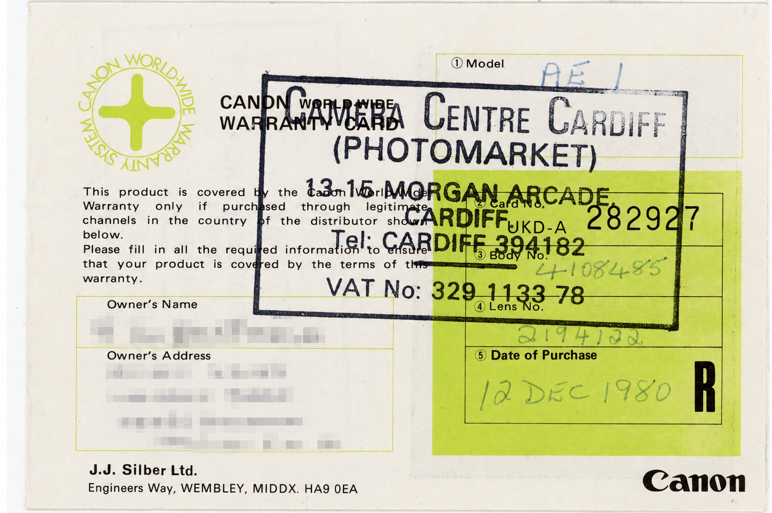 Canon world-wide warranty card for a Canon AE-1 stamped Camera Centre Cardiff (Photomarket), 13-15 Morgan Arcade, dated 12 December 1980