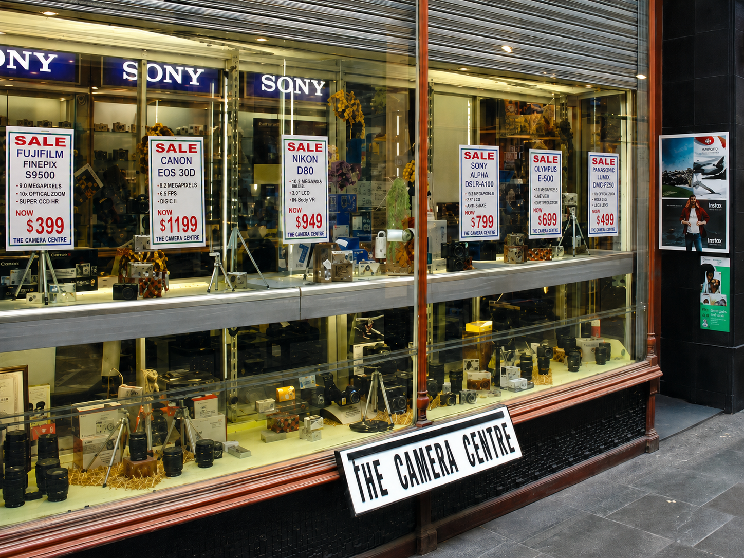 The Camera Centre shop window in the digital era with Sony, Canon and Nikon cameras on display